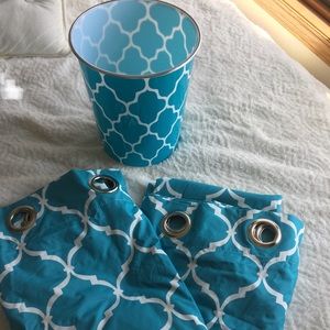 Teal curtains with matching trash bin